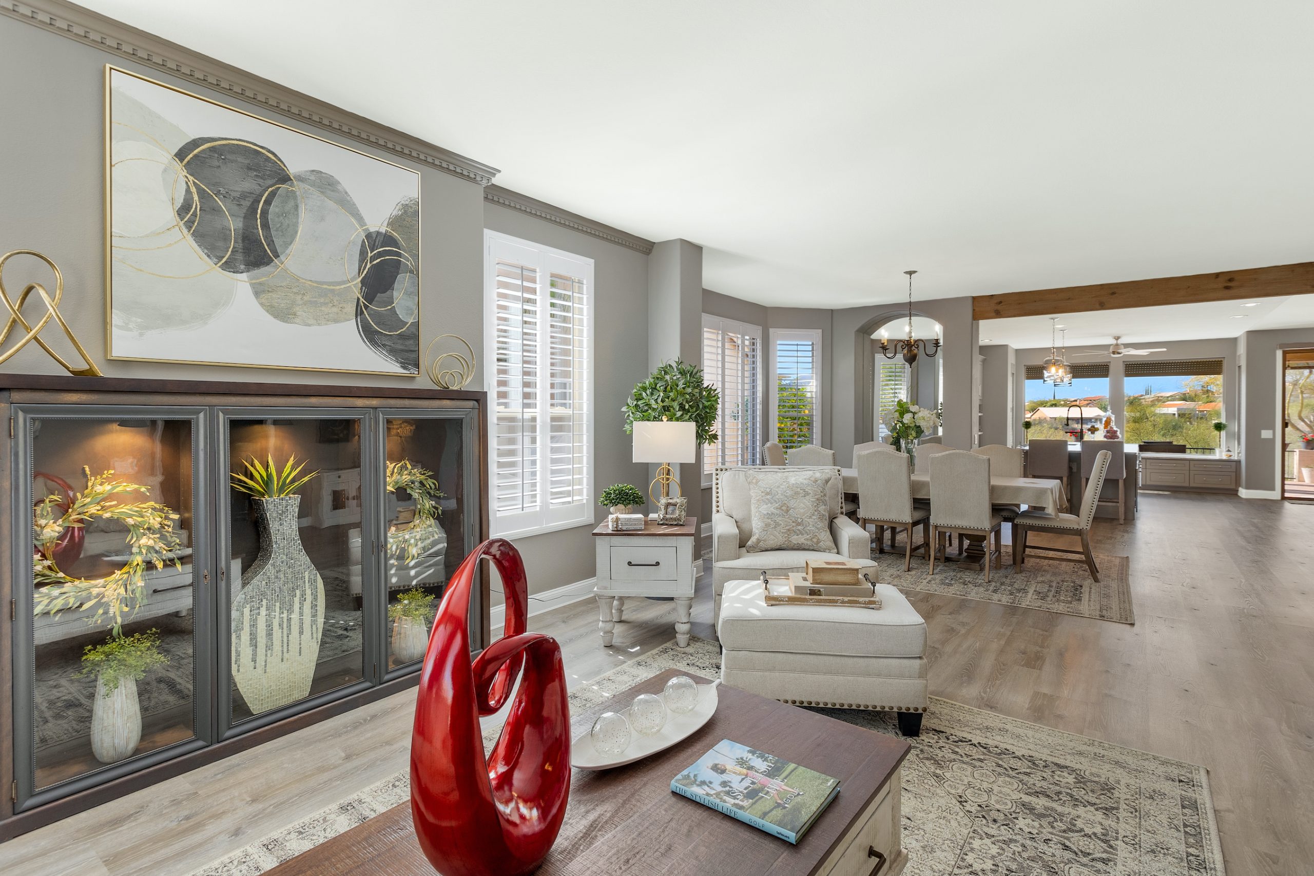 The interior of a beautiful modern house with a large artistic vase on the table.